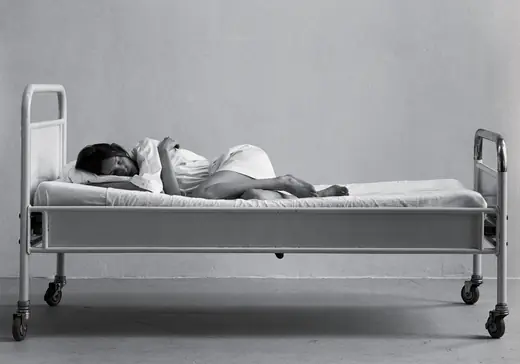 A.F. Vandevorst S/S 1999 “Dreaming”: model asleep on a hospital bed, black-and-white photograph