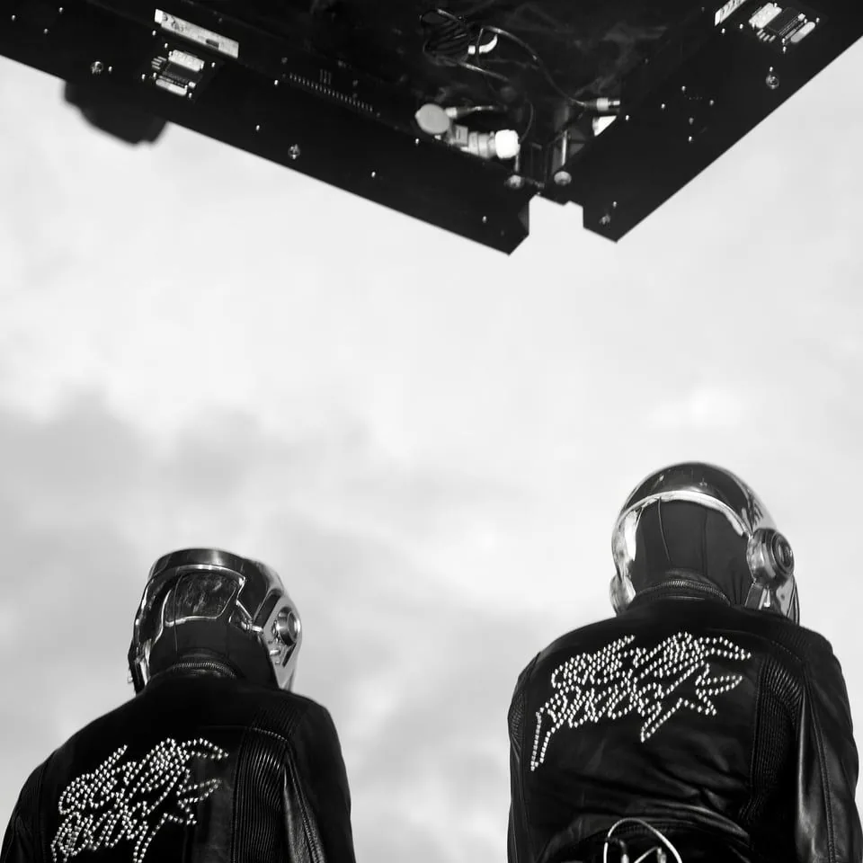 Daft Punk from behind, the studded logo on their Dior Homme jackets