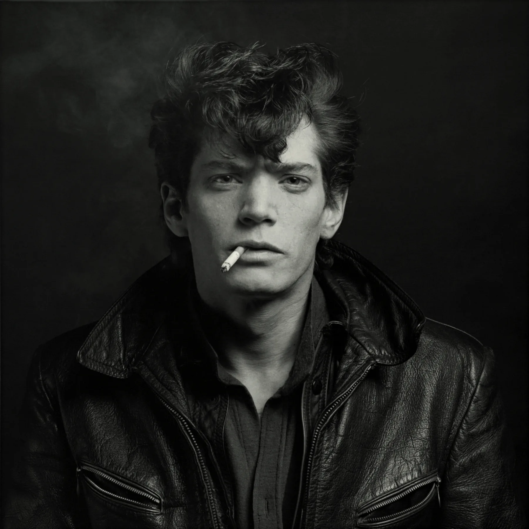 Robert Mapplethorpe, self-portrait with a cigarette and leather jacket, 1980